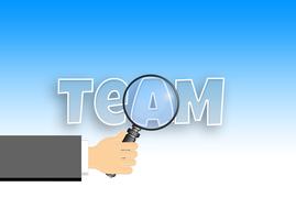 View of "Team" sign though the magnifying glass in the hand, at blue and white, gradient background, clipart