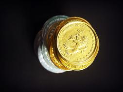 stack of coins on black background