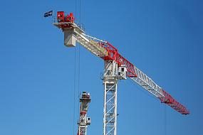 white-red crane on the background of a clear blue sky