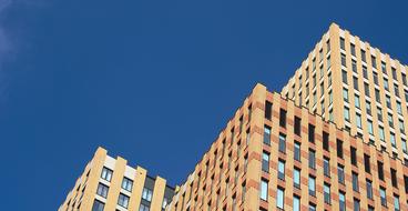 top of high orange Building at blue sky