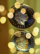 coins in gold bokeh background