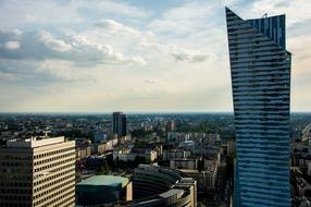 Cityscape of the city, with buildings and skyscrapers, under the sky with clouds