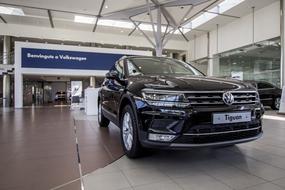 Beautiful, shiny, black "Volkswagen Concessionaire" car in the building