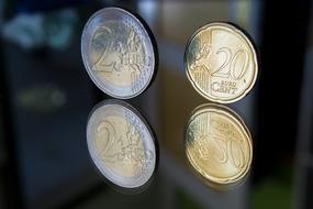 Close-up of the beautiful, shiny, metal "Euro" coins with reflections