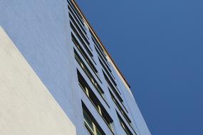 Office building with the windows, in Auschwitz, Poland, under the blue sky