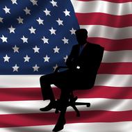 silhouette of a businessman in a chair against the background of the american flag