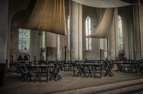wooden tables and chairs in the hall