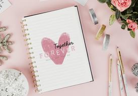 notebook, decorations and pencils on the table