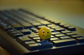 ball with Smiley on keyboard