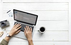 Aerial laptop and hands