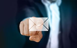 businessman touching email button