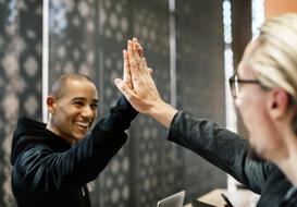 Achievement of Agreement, two man making high-five gesture