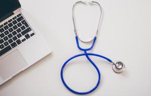 Stethoscope near laptop, Medical care