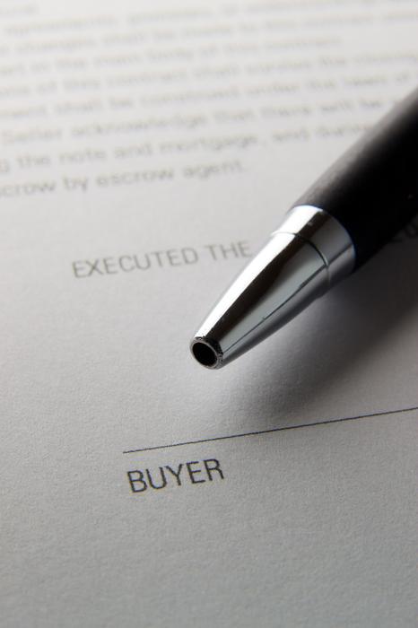 pen at buyer line on Contract Close-Up