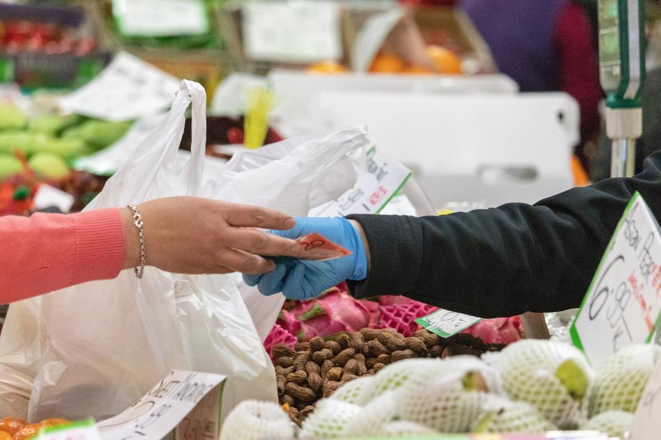 transferring money to the seller in the market