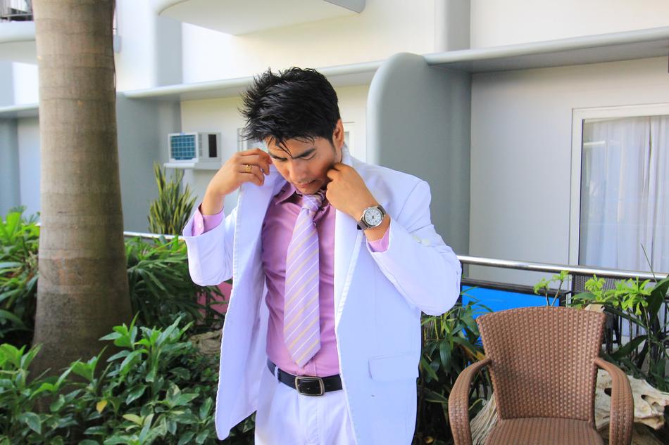 guy in a white suit near the house