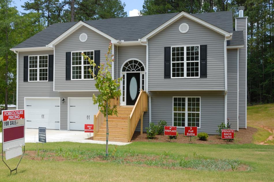 Home For Sale grey and red sign