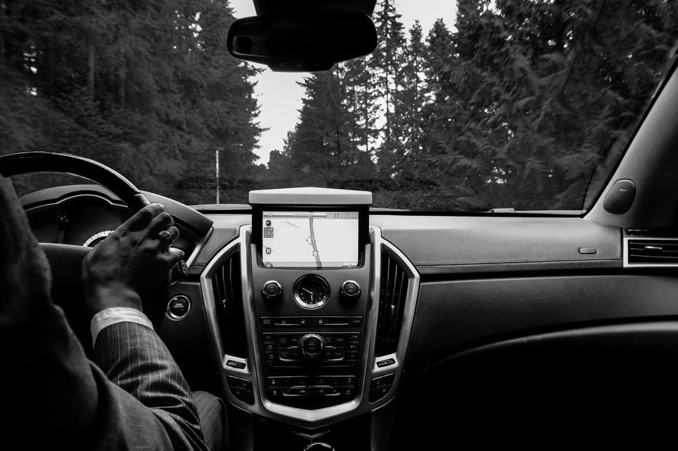man in suit in the car