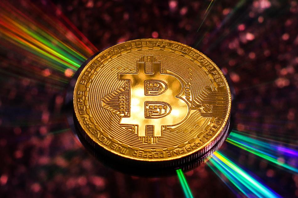 bitcoin in the rays as a background
