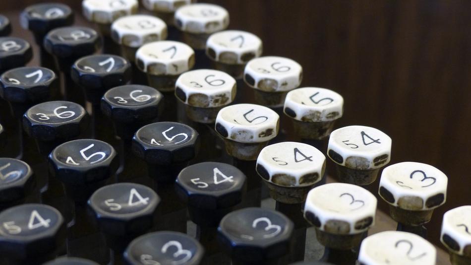 Vintage type machine with white and black buttons