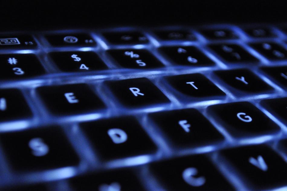 Beautiful laptop keyboard with blue lighting