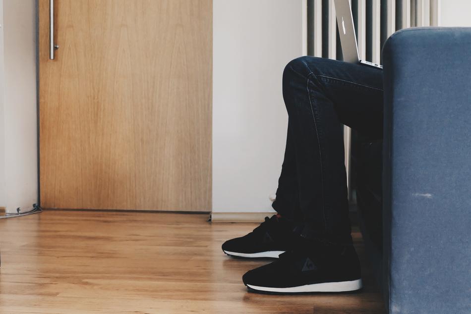 laptop on legs in room