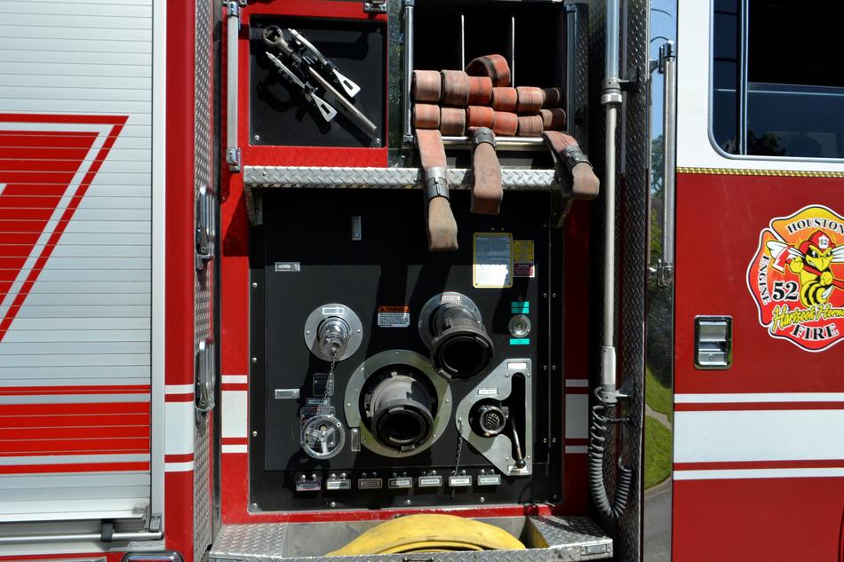 Supplies with the hose of the red and white fire engine