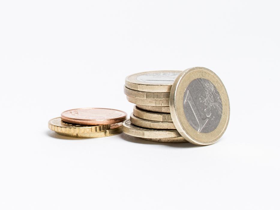 closeup view of euro coins on the white background