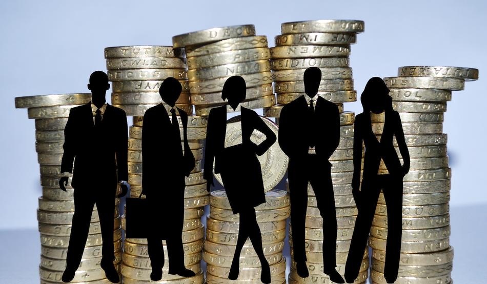 silhouettes of people on the background of coins