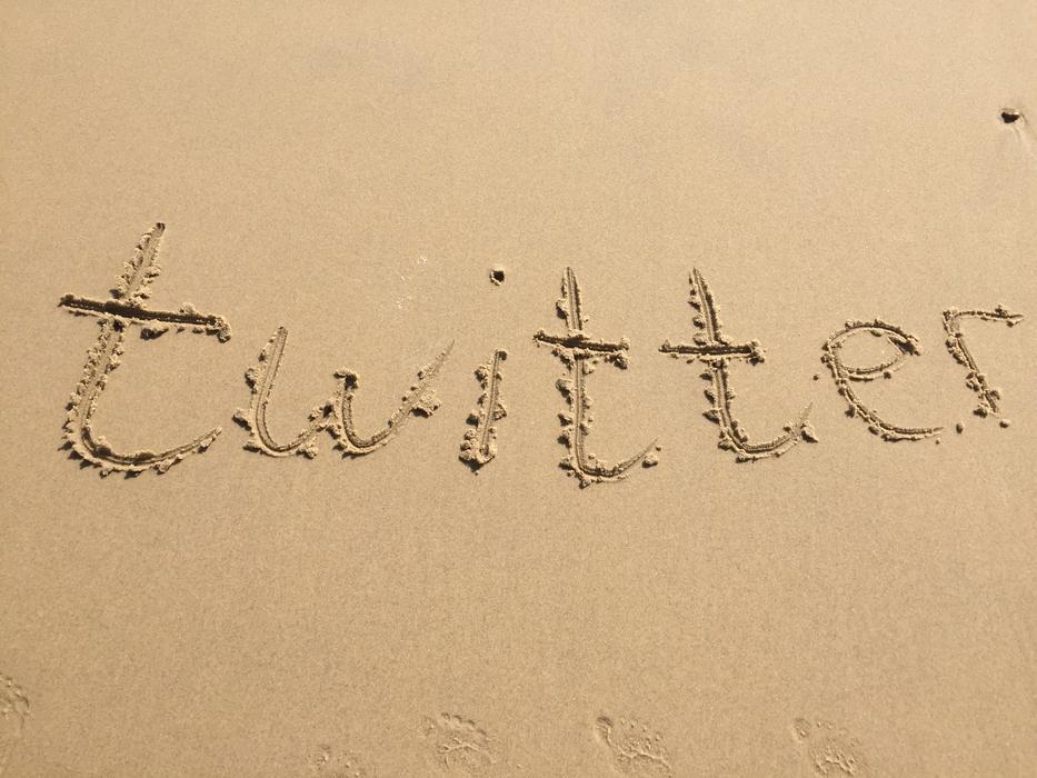 the inscription twitter on the sand