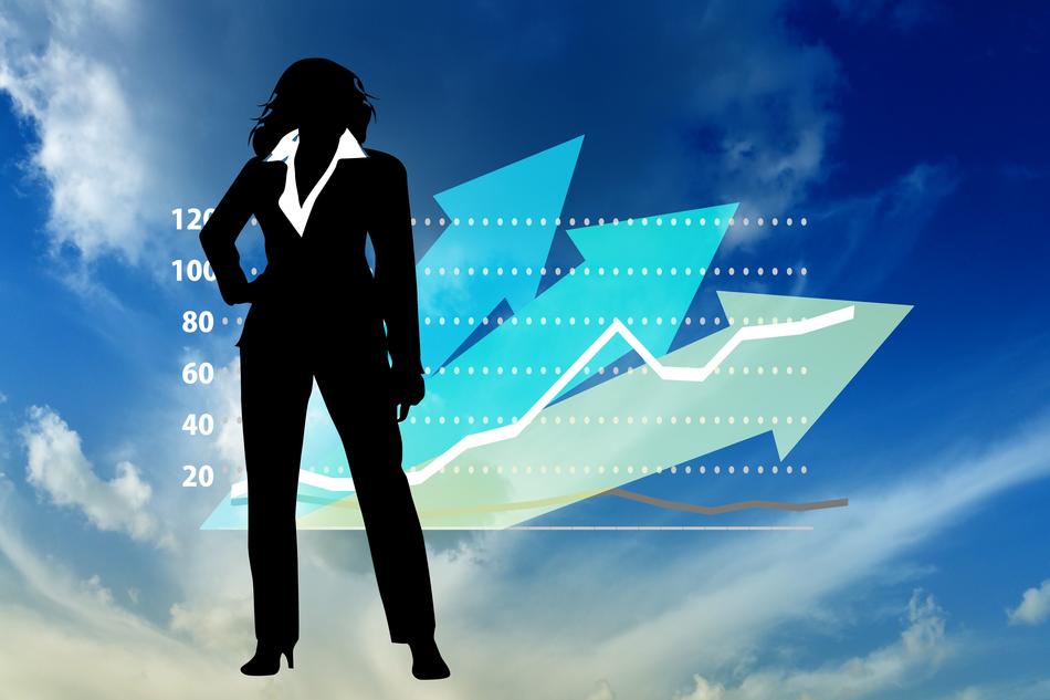 businesswoman silhouette in front of chart at sky