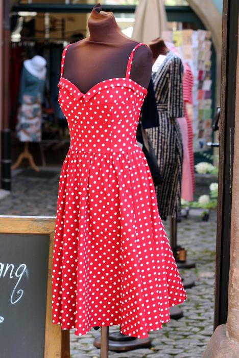 Beautiful, red and white dress with dots, on the stand