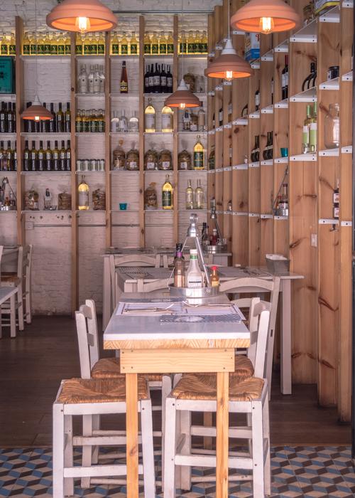 Beautiful and colorful interior of the bar, with the shelves and lights, in Spain