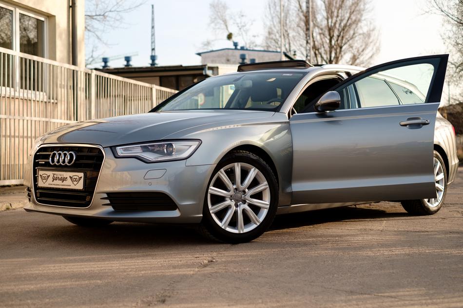 grey Audi Auto parked at building