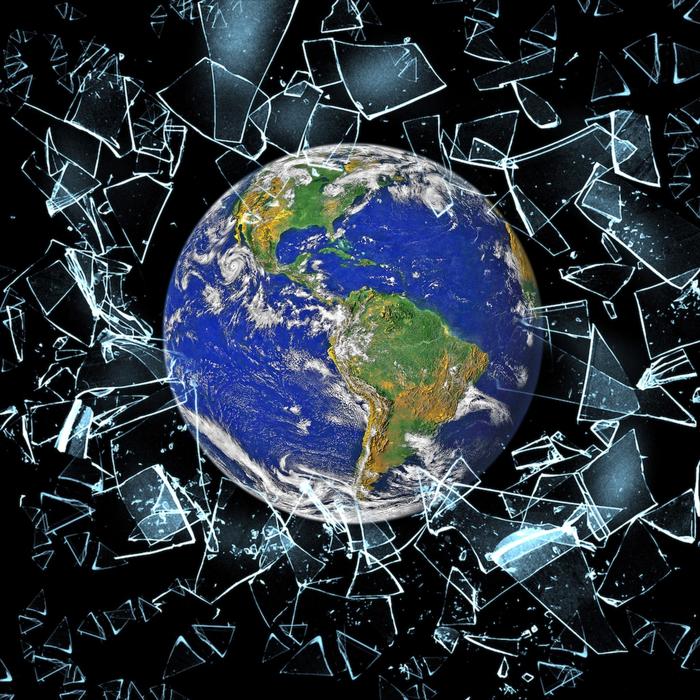 Colorful Earth, among the glass debris, at black background, on clipart