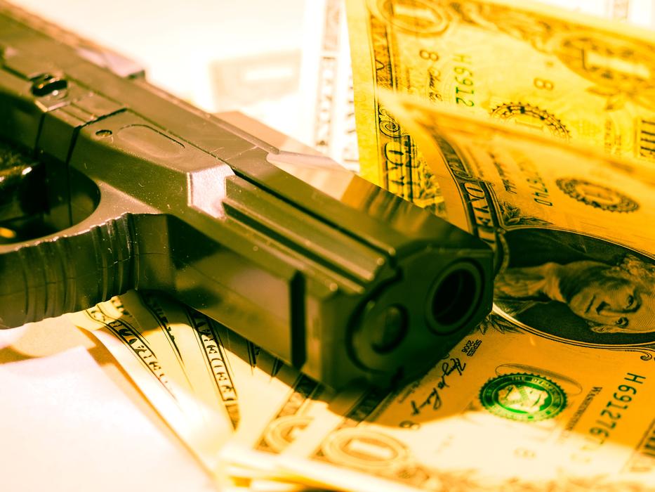 wallpaper with pistol and dollars