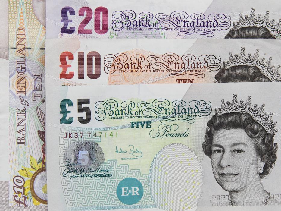 Colorful Pound banknotes, with the portraits of Queen Elizabeth, in England
