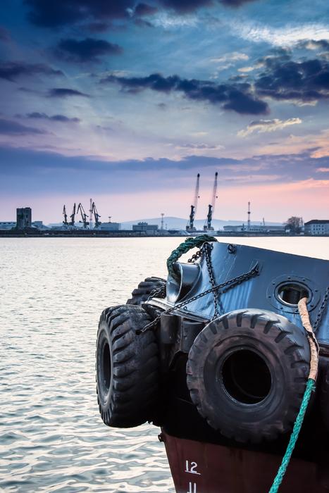 car tires in tow in the harbor