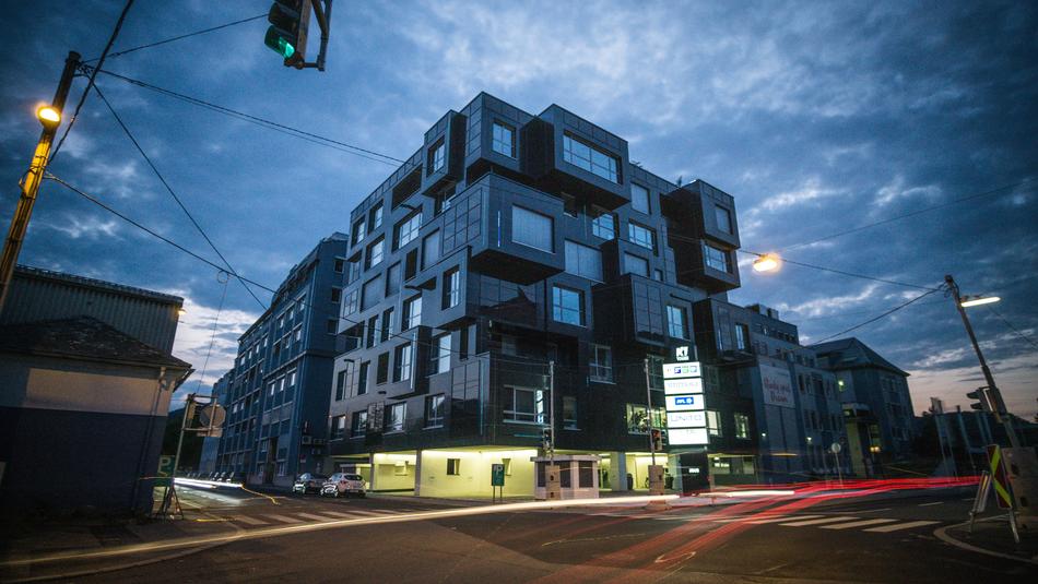 modern building at the crossroads at dusk