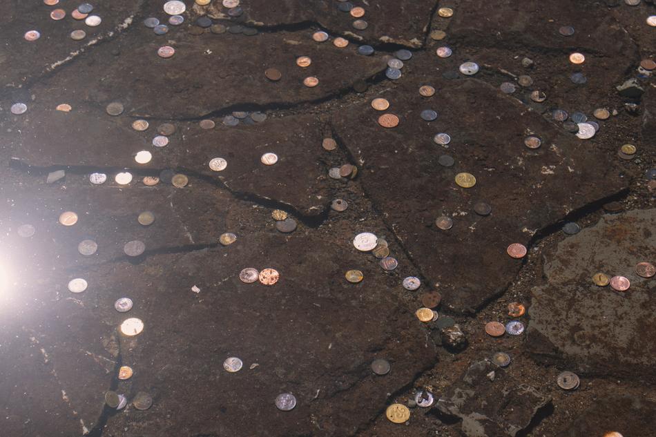 photo of coins at the bottom of the fountain