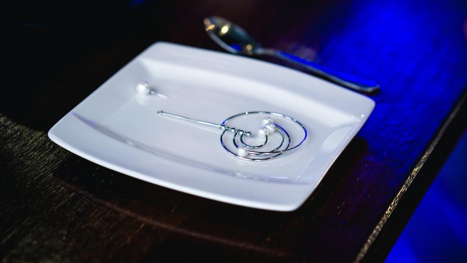 white plate with a pearl in a restaurant