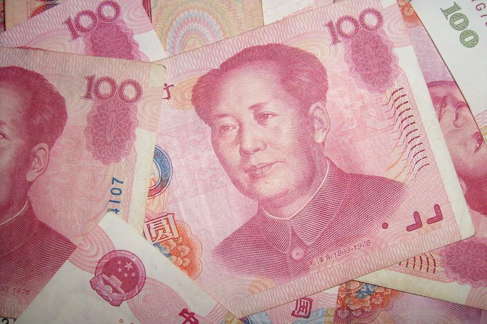 Pile of the colorful, Chinese Yuan banknotes with portraits