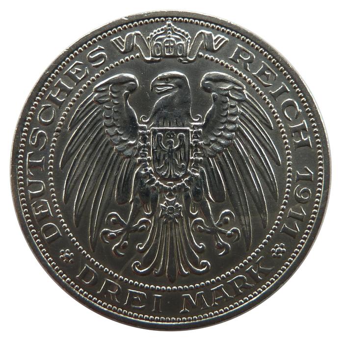 Close-up of the beautiful Mark coin with the bird, at white background