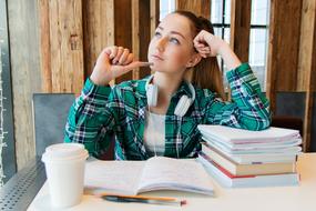 girl doing homework at the table