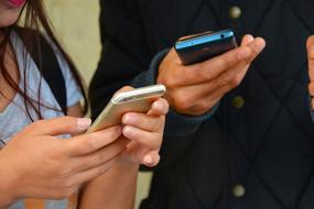 mobile phones in hands close-up