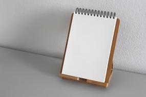 blank notebook on stand