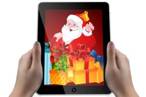 Christmas Time, santa with gifts on screen of tablet in female hands at white background