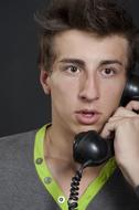 young man is talking on the phone