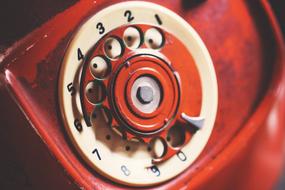 Close-up of the beautiful, shiny, classic, aged telephone, in light