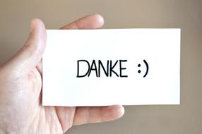 danke, Thank You messade on a card in a hand